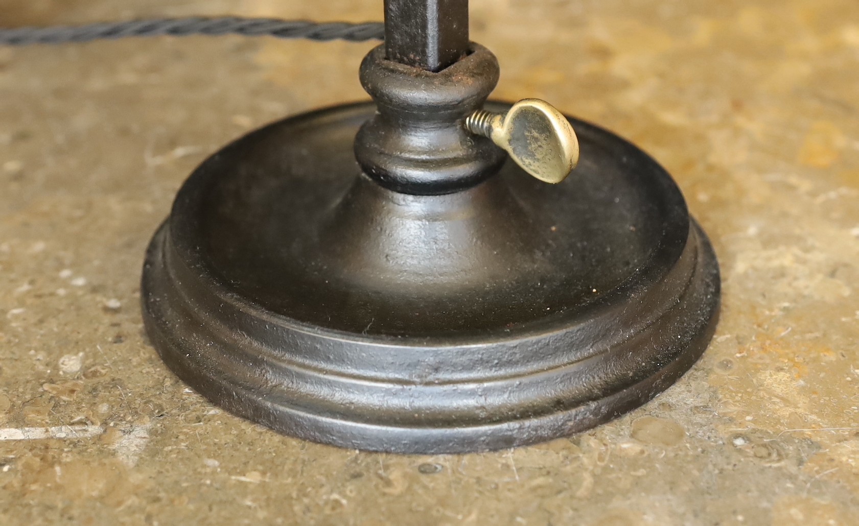 A 1930s English brass wrought iron and cast iron adjustable desk lamp with moulded opaque glass shade, height 66cm